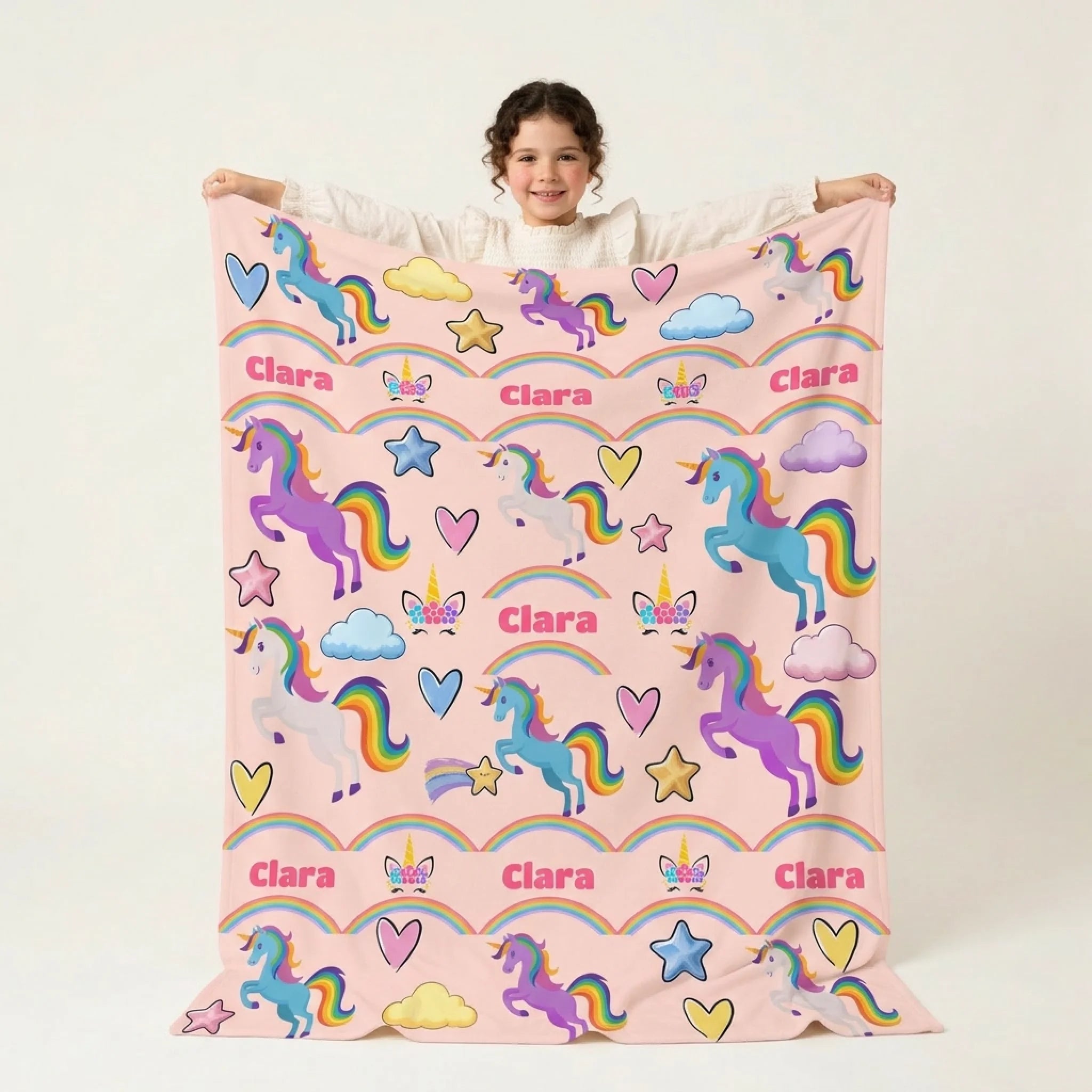 Clara with rainbow unicorn blanket