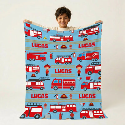 Lucas with fire truck blanket