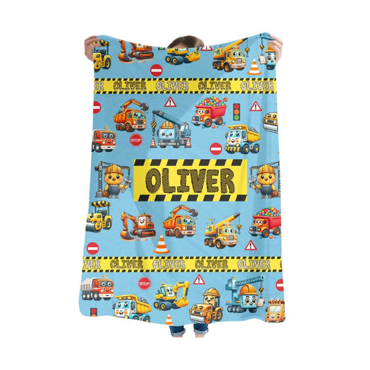 A person holding a sky blue color Kids Personalized construction vehicle blanket 